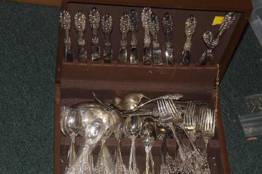73 Pieces of Silverplate Flatware: partial set - inside a wooden case