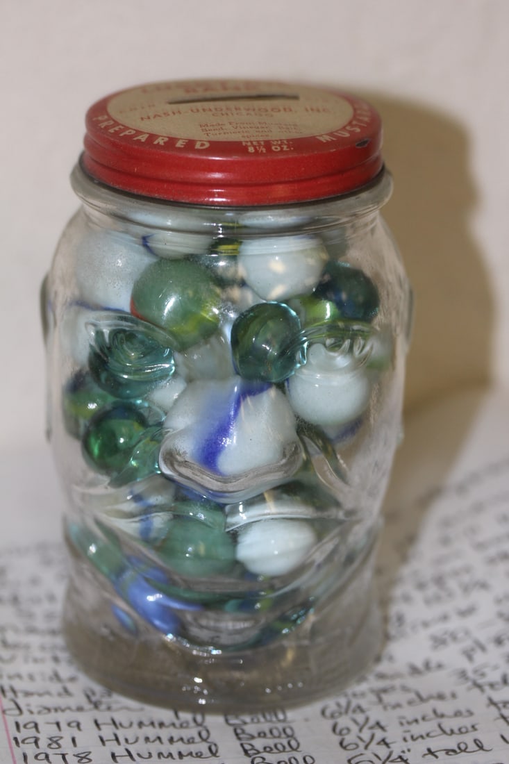 Jar of Different Size of Marbles: as shown