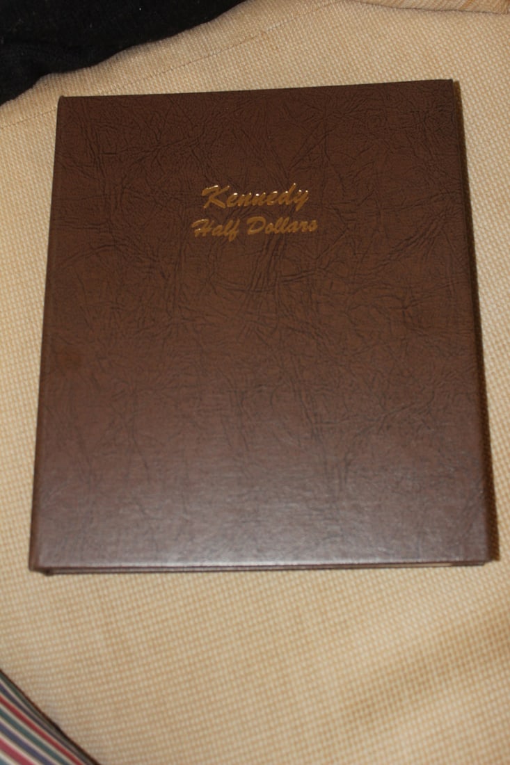 Kennedy Half Dollar Coin Book: with coins - total of 84 coins with 8 of them are silver: 2coins= 90% silver, 6 coins= 40% silver