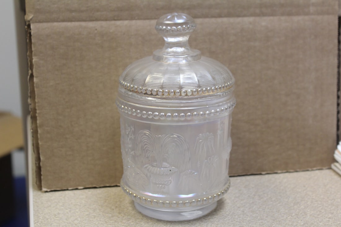 Signed Carnival Glass Jar: signed N or Norwood - clear iridescent carnival glass - rare - please note: inside chip on the lid as shown, not noticeable when lid is on - 6 7/8" tall