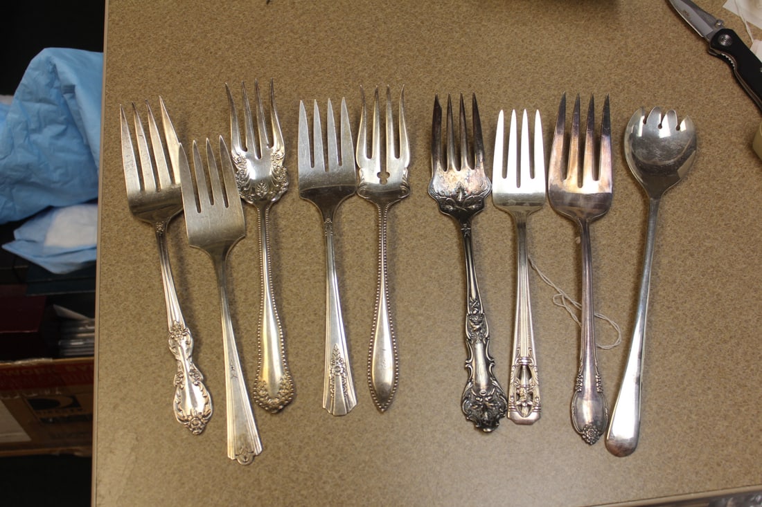 Lot of 9 Silverplate Serving Forks: each approximately 8 1/2" long - some ornate