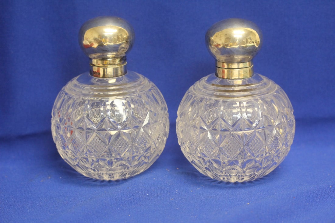 Set of 2 Sterling Top Cut Glass Perfume Bottles: 6 inches tall each