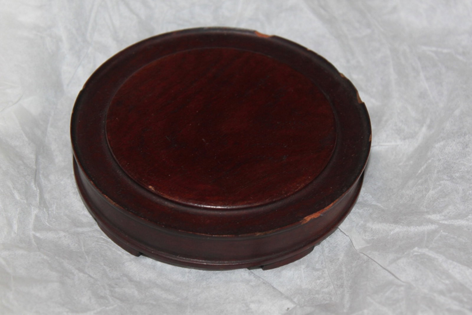 Antique Chinese Wood Stand: Circa 19th / 20th century. Diameter is 4 3/4" inches. - There are some chips. Raised on the middle.