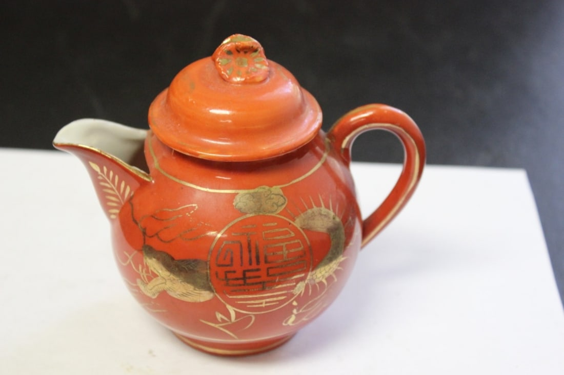 A Vintage Porcelain Japanese Creamer: Marked on the bottom - 4 3/4 inches tall