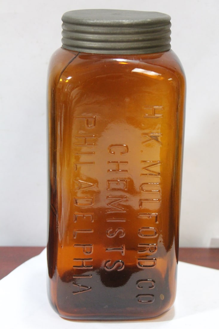 A H.K. Mulford Chemist Bottle: Marked "P" Philadelphia on the bottom - large size with lid - 8 7/8" tall