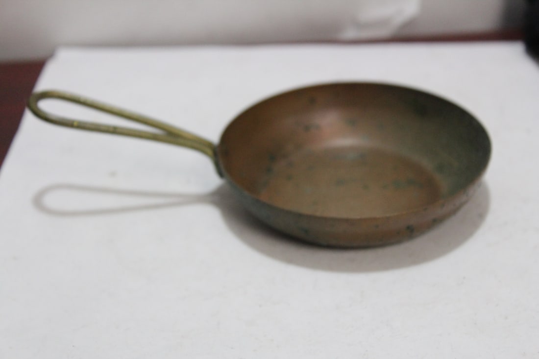 A Small Copper Pan: 3 3/4" in diameter without the handle