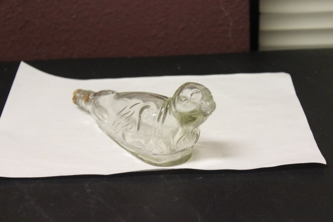 A Seal Form Bottle with Stopper: 7 3/4" long