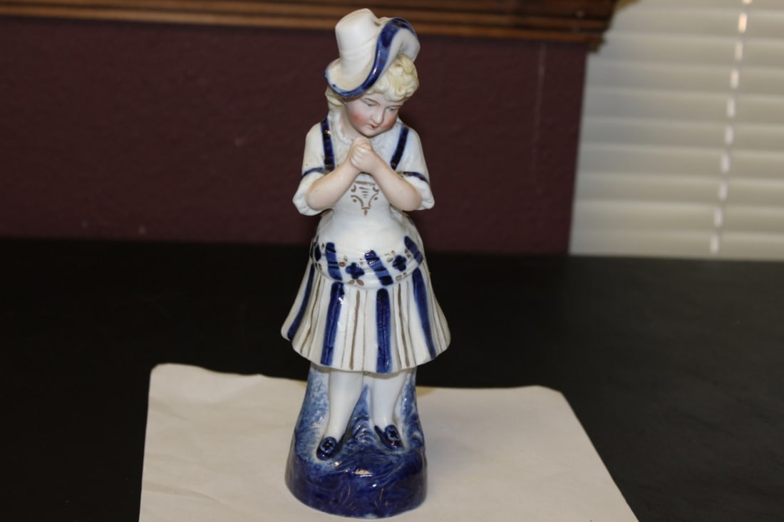 An Antique German Porcelain Figurine: 8 1/2 inches tall - early 1900's