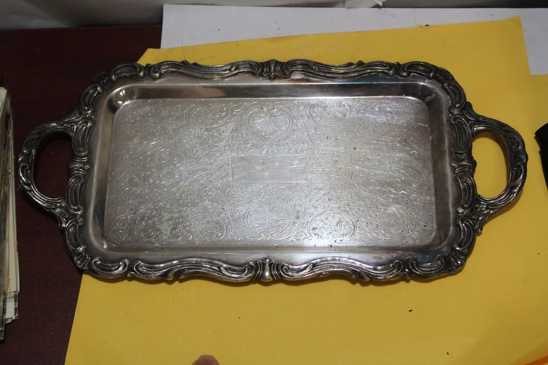 A Silverplated Ornate Tray: 12" across
