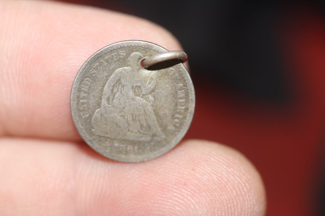 An 1861 Silver Half Dime: please note: hole