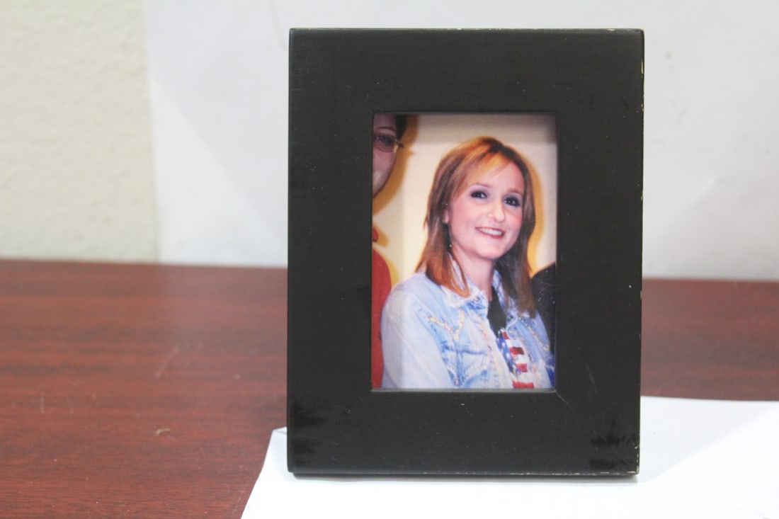 A Small Melissa Etheridge Print: most likely a print - overall= 4 3/4" x 3 3/4"