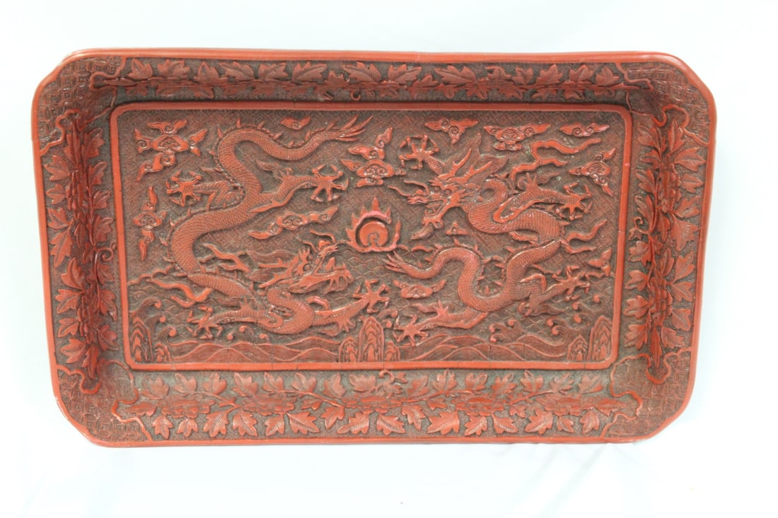 A Chinese Cinnabar Tray: well carved - please note: one small chip as shown - 12 1/4" x 7 1/8"