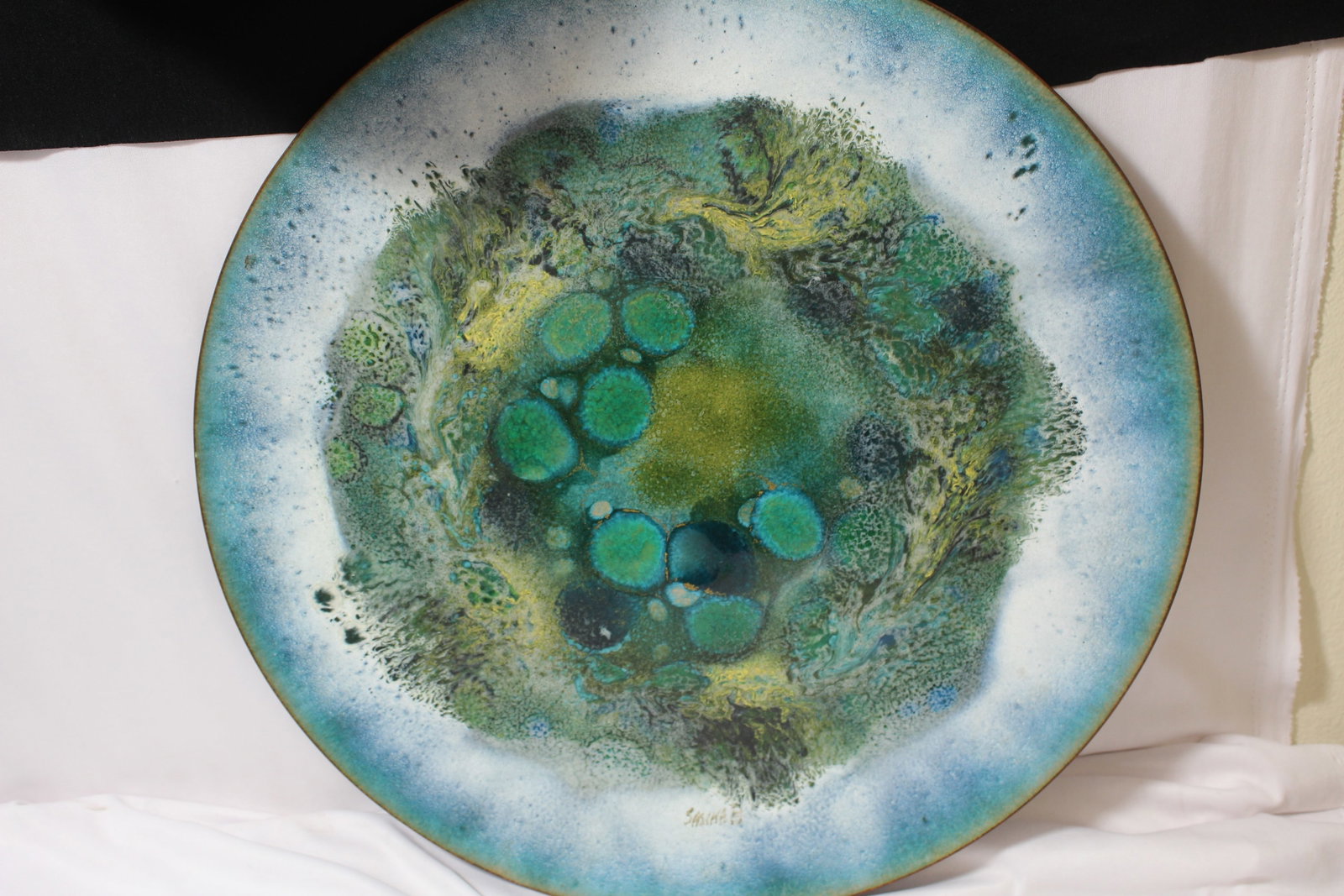 An Enamel Charger on Copper: 18" in diameter - signed
