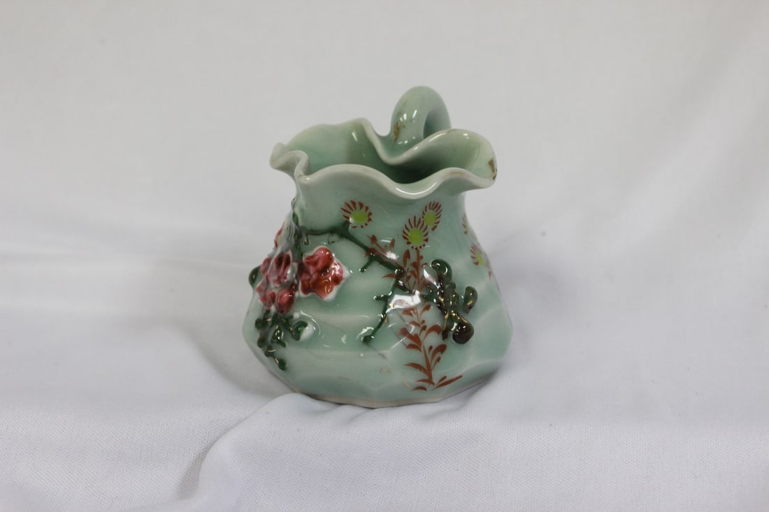 An Asian Celadon Pitcher: chinese/Japanese/Korean - signed on the bottom - 3 1/8" tall