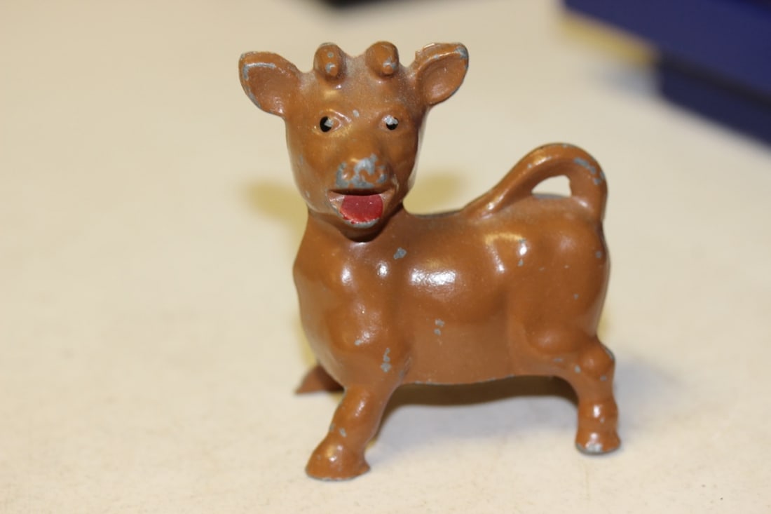 A Metal Cow Pepper Shaker: 3" tall