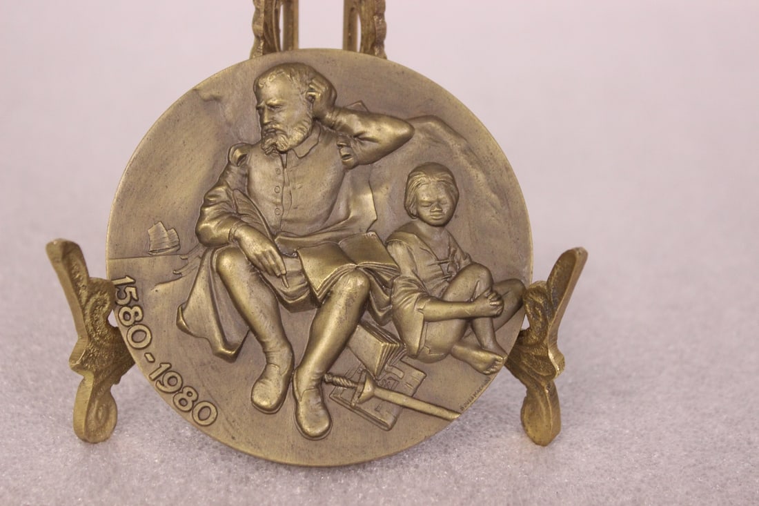 A Bronze Plaque: 3 1/8" in diameter