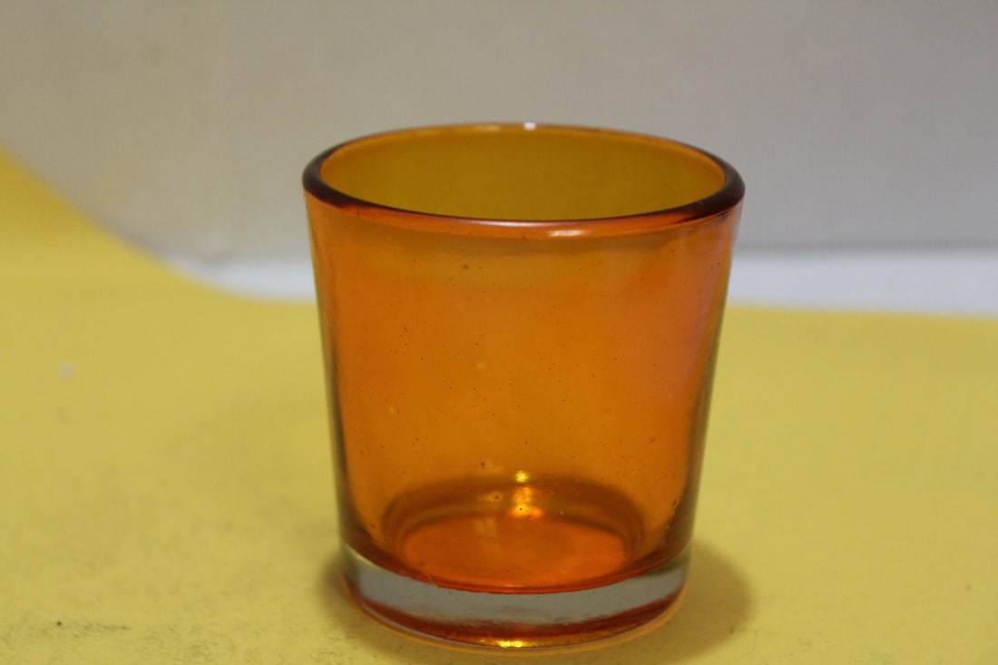 An Amber Glass Cup: 2 1/4" tall
