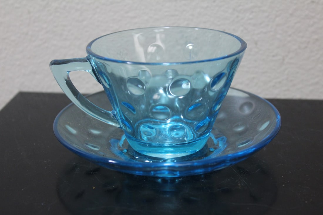 A Teal Colour Glass Cup and Saucer: cup= 2 1/4" tall