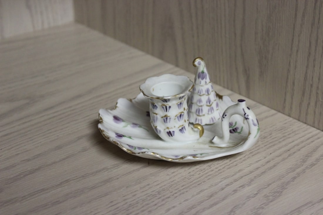 A France Candle Holder with a Porcelain Stuffer: candle holder is porcelain - extremely rare with the stuffer - 5 inches in diameter