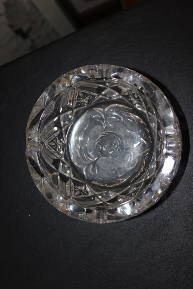 A Cut and Press Glass Ashtray: Thick and heavy - 6 inches in diameter