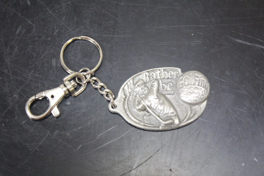A Pewter Golfing Keychain: as shown