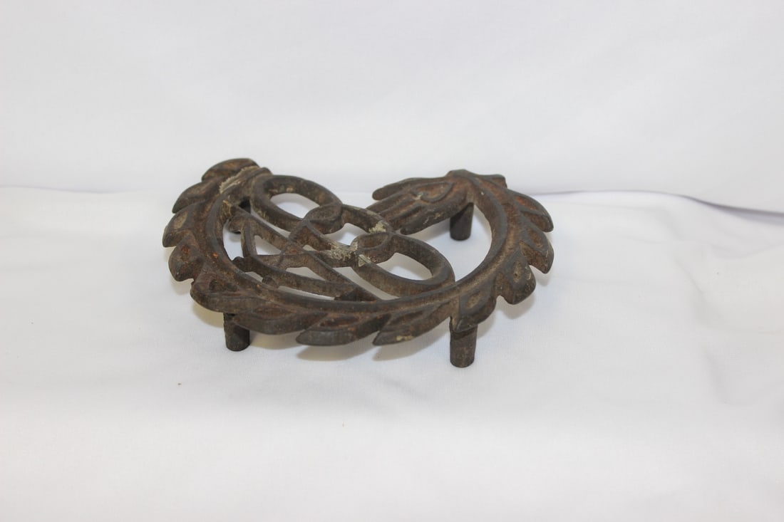 A Cast Iron Trivet: 5 1/2" in diameter