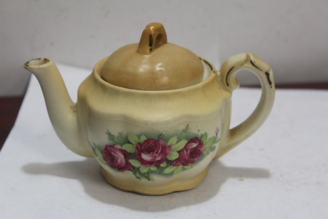 A Small Ceramic Teapot: 5 1/2" across