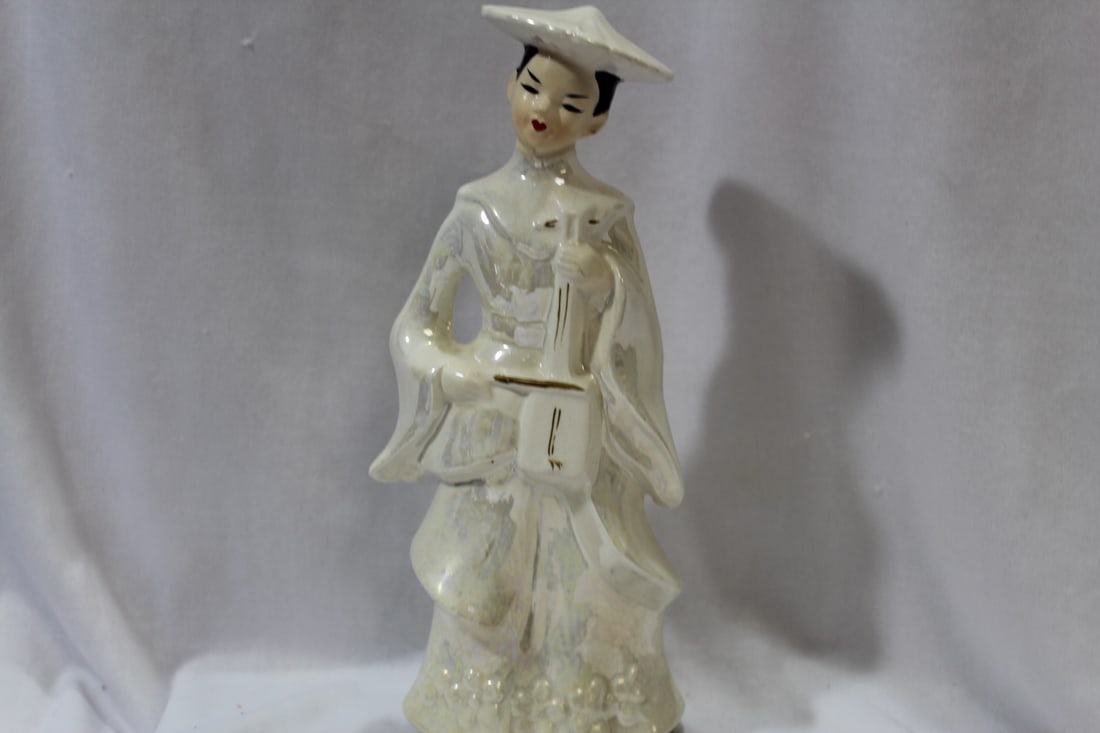 A Ceramic Girl Figurine: 9" tall