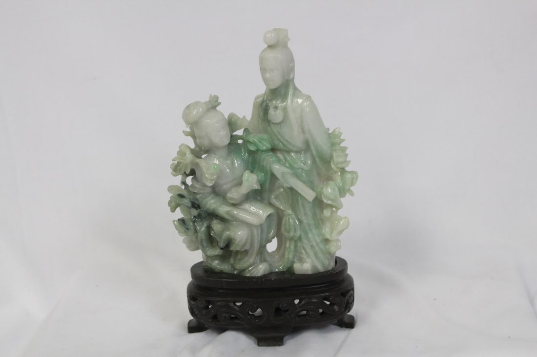 A Chinese Jadeite Statue on Stand: please note: loss on the hair part on one of the lady - nice carving - 5 1/4" tall without the stand