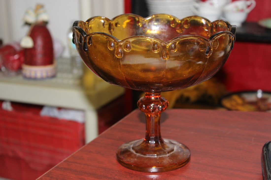 An Amber Glass Compote: 7 3/4" tall x 8 1/4" in diameter