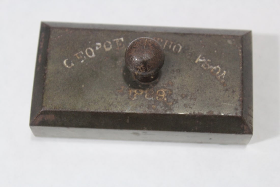 A Personal Heavy Metal Paperweight: 4 1/2" long - antique - dated 1889
