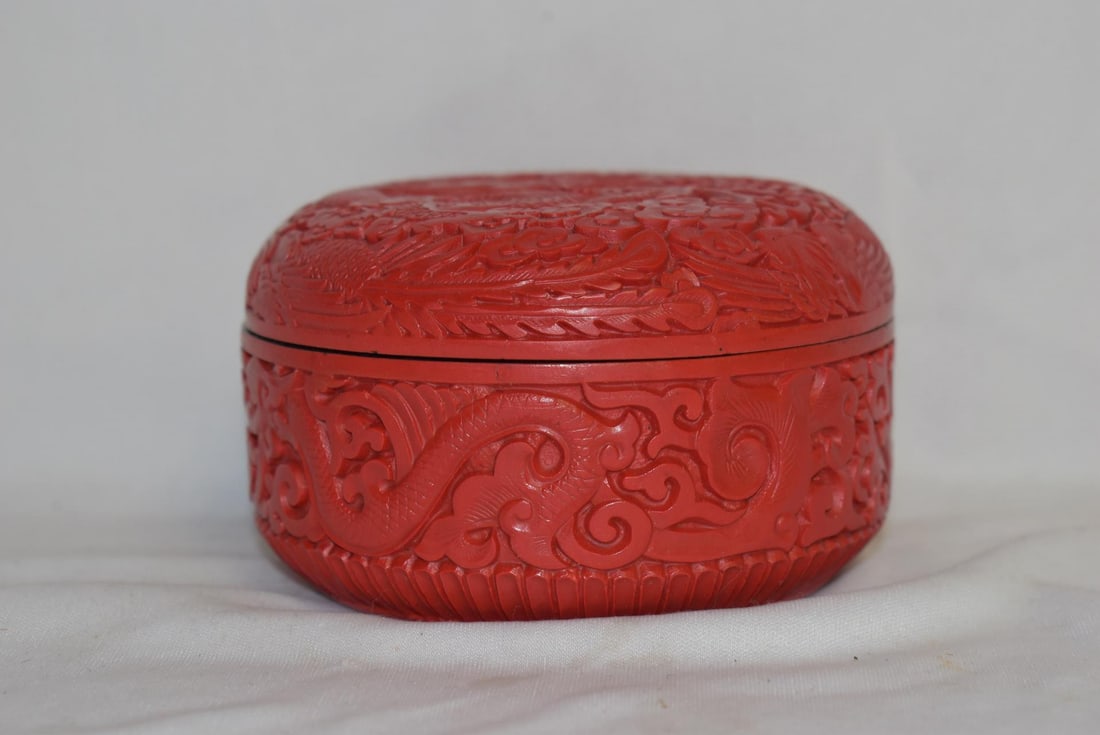 A Cinnabar Resin Round Box: please note: interior chip, not noticeable when lidded - 4 1/2" in diameter