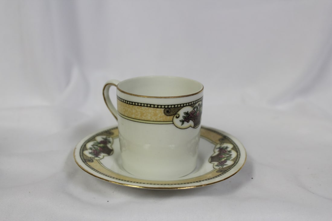 A Dematesse Cup and Saucer: 2 3/8" tall