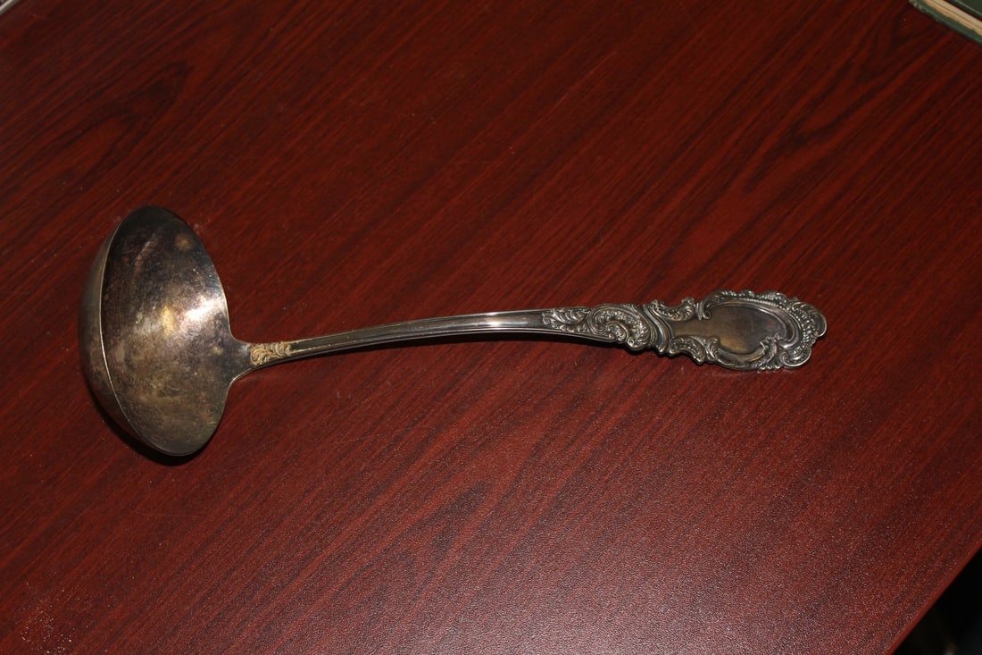 An Ornate Silverplated Laddle: marked - 10 3/4" long