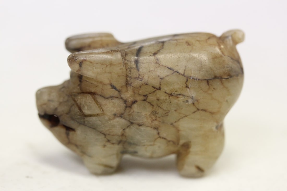 A Small White Jade Pig: some russett - 1 7/8" across - vintage - most likely republic period