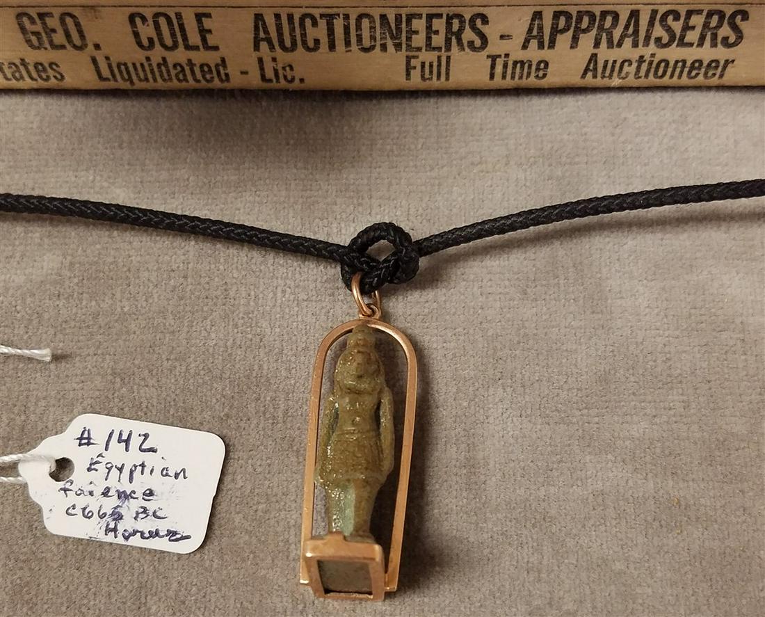 EGYPTIAN FAIENCE USHABTI PENDANT OF HORUS, SET INTO A: EGYPTIAN FAIENCE USHABTI PENDANT OF HORUS, SET INTO A 20th c. GOLD SETTING, FROM "THE SECRET EYE", MADISON AVE, NYC, c.665BC