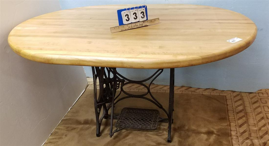 OVAL BUTCHER BLOCK TOP TABLE W/ SEWING MACHINE BASE, (1 of 2)