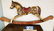 CARVED WOOD POLYCHROMED ROCKING HORSE, SIGN T.P. ROOKS