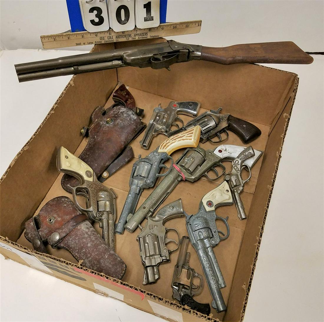 BOX OF 9 TOYS GUNS, LONE RANGER, STALLION 45, 2 TEXANS,: BOX OF 9 TOYS GUNS, LONE RANGER, STALLION 45, 2 TEXANS, A AMER., WEST FRONTIER 45, CORBEL THE COLONEL, 2 TROOPERS, DAISY DOUBLE BARREL SHOTGUN, PONY + GLASS