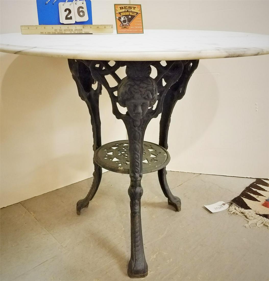 CAST IRON BASE TABLE W/ MARBLE TOP, 29"H X 35.5" DIAM. (1 of 2)