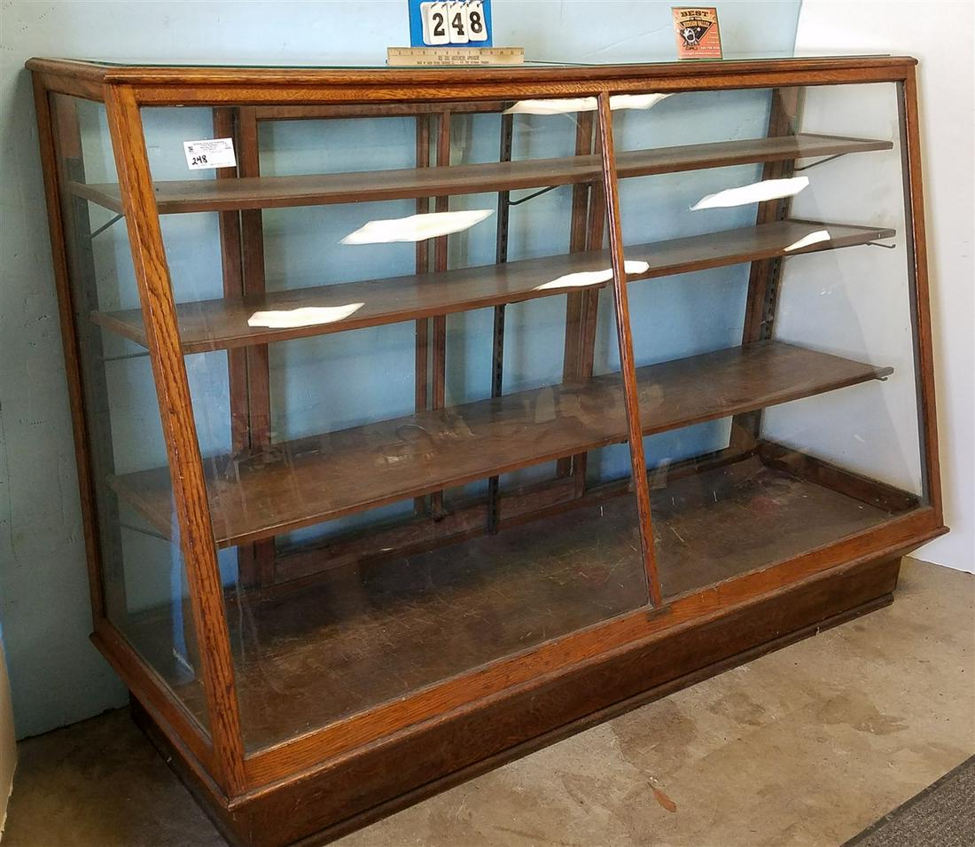 c.1900 COLUMBUS SLANT FRONT OAK SHOWCASE, 49.5"W X 6'W (1 of 4)