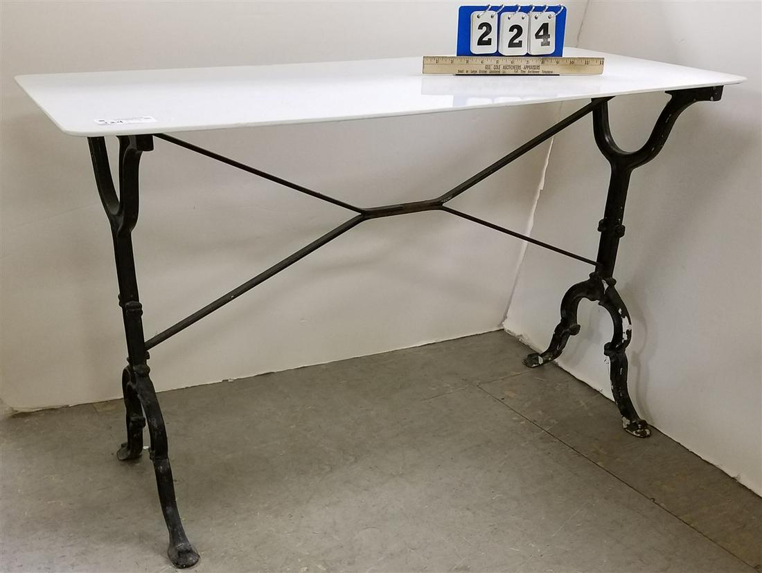 CAST IRON BASE TABLE W/ MILK GLASS TOP, 27.5"H X 44"W X (1 of 2)
