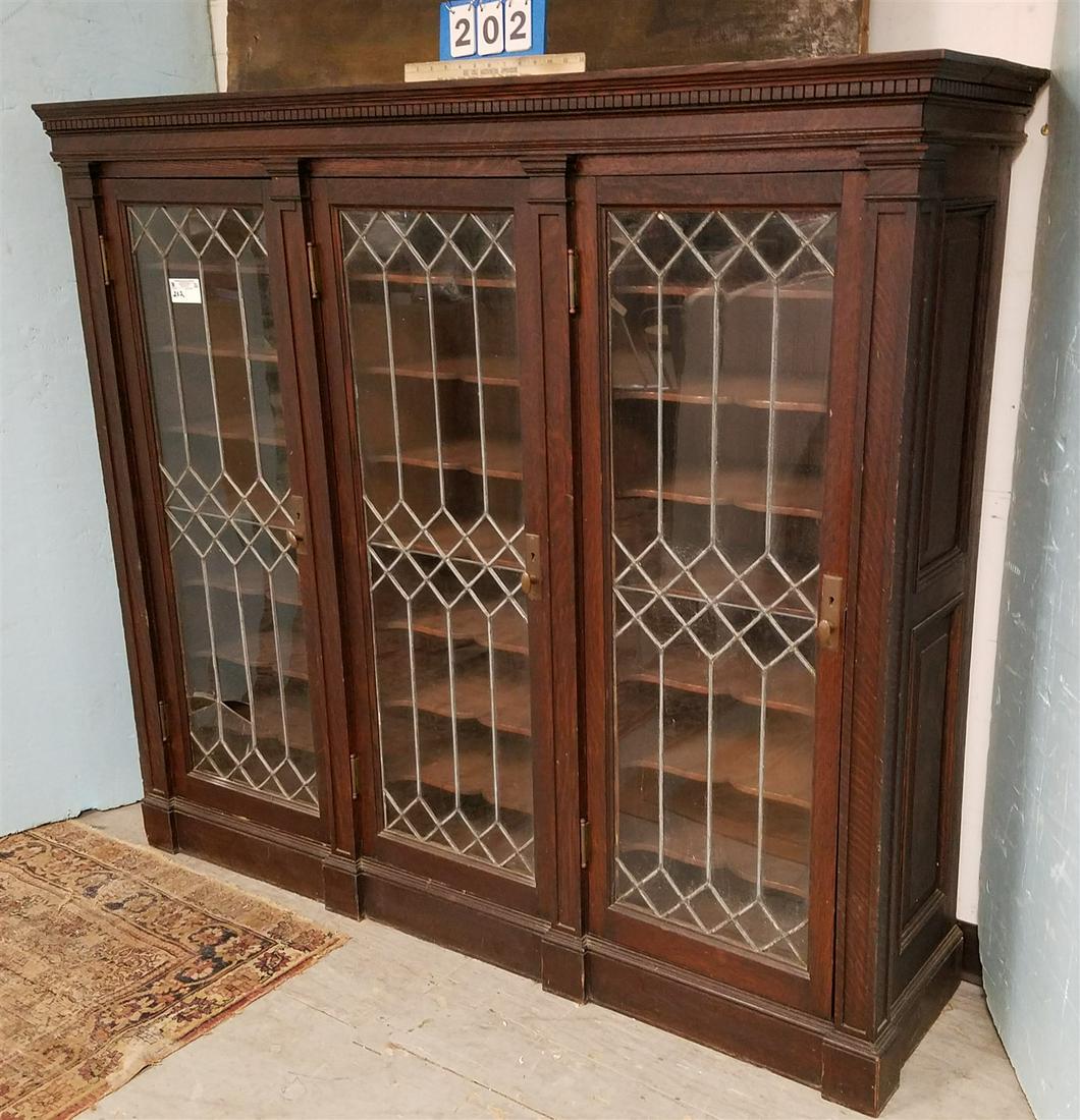 OAK 3 DOOR MUSIC CABINET W/ LEADED GLASS PANELED DOORS,: OAK 3 DOOR MUSIC CABINET W/ LEADED GLASS PANELED DOORS, 54.75"H X 63"W X 15.75"D
