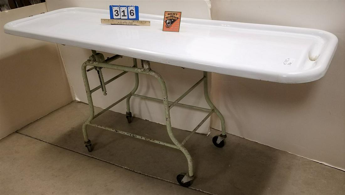 ADJUSTABLE ENAMELED EMBALMING TABLE, 35"H X 77"L X: ADJUSTABLE ENAMELED EMBALMING TABLE, 35"H X 77"L X 26.5"W