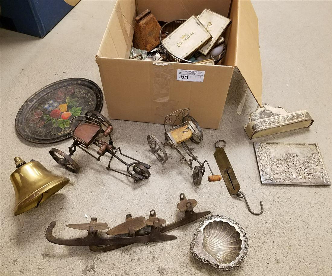 BOX OF PRIMITIVE ITEMS - ICE SKATES, IRON TRIVETS, TOLE (1 of 3)