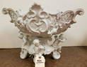 BISQUE FIGURAL COMPOTE 12 1/2"H X 17 1/2"W X 11 1/2"D