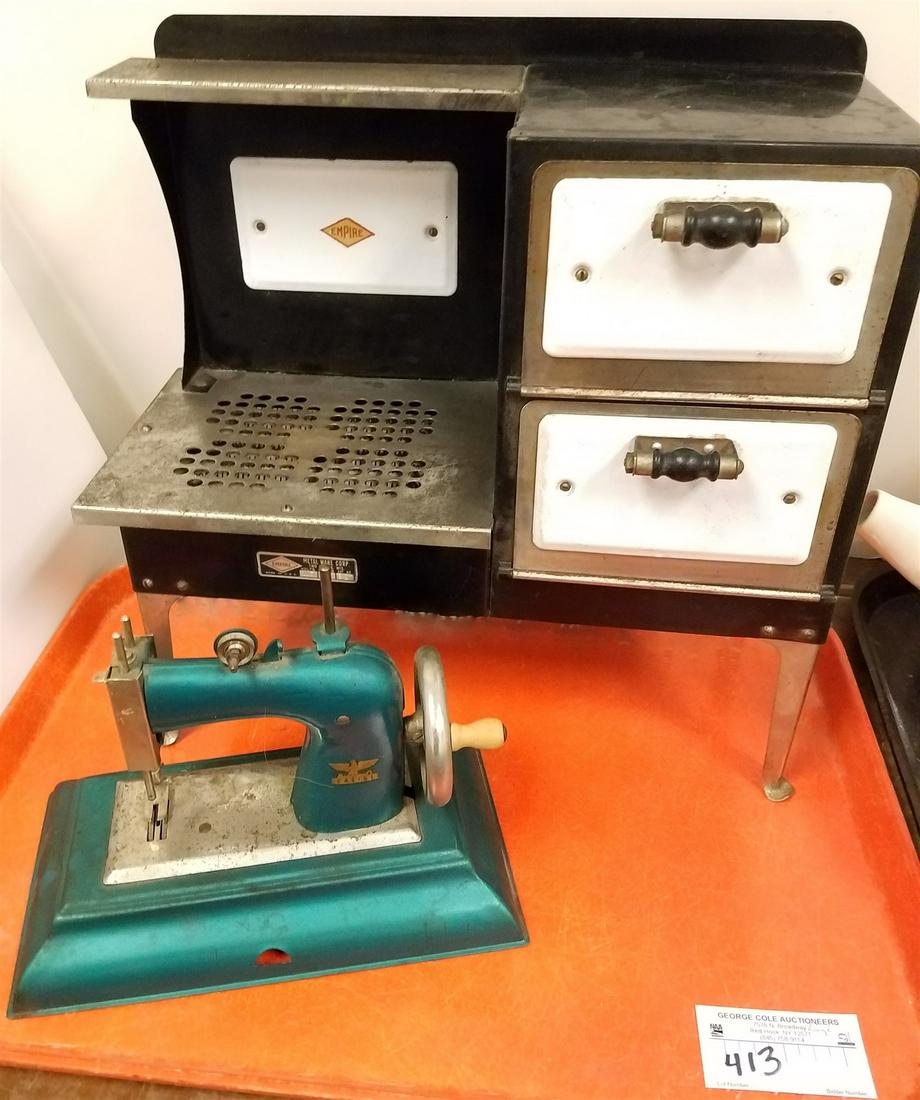 TRAY EMPIRE METAL WEAR CO. TOY STOVE SEWING MACHINE (1 of 4)