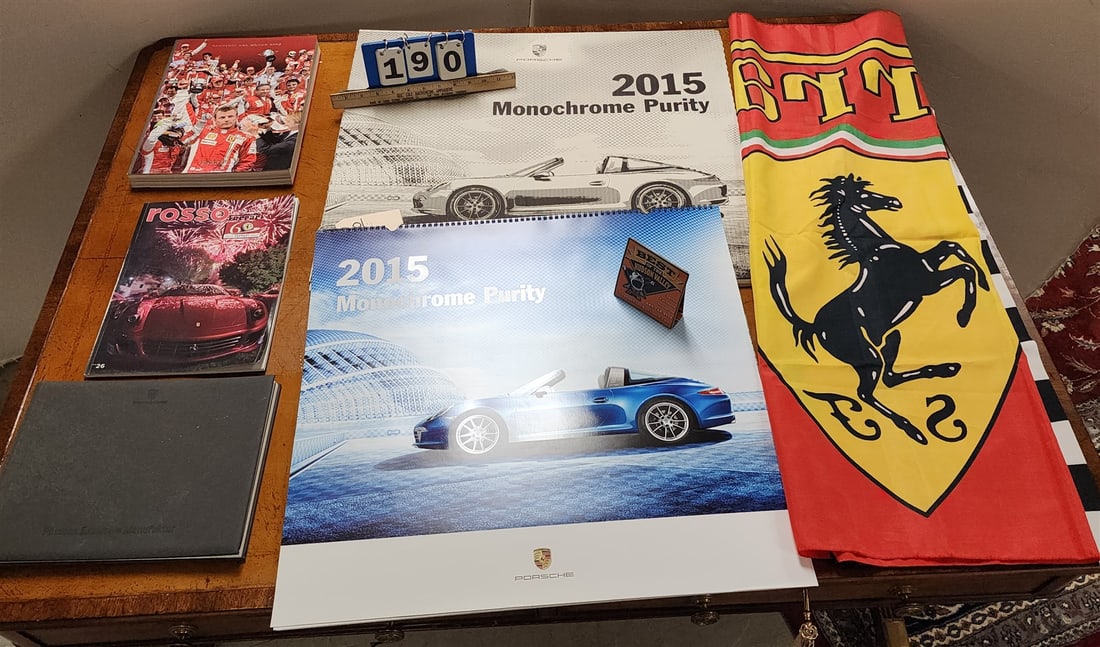 2015 Porshe drivers selection advert calendar, folder 22" x 23-1/2" and Ferrari flag 39" x 51",: 2015 Porshe drivers selection advert calendar, folder 22" x 23-1/2" and Ferrari flag 39" x 51", Ferrari 2007 bk Campioni del Mondo, 2007 Ferrari roddo bk and Porche Exclusive Manufaktur bx H- W- L-