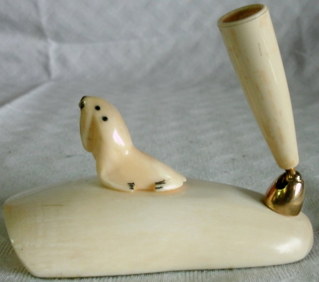 Alaskan Hand Carved Ivory Figural Pen Holder - Seal: Vintage Alaskan hand carved ivory pen holder / stand with figural carved seal.MEASUREMENTS: 4" long x 2 3/8" wide x 3" high