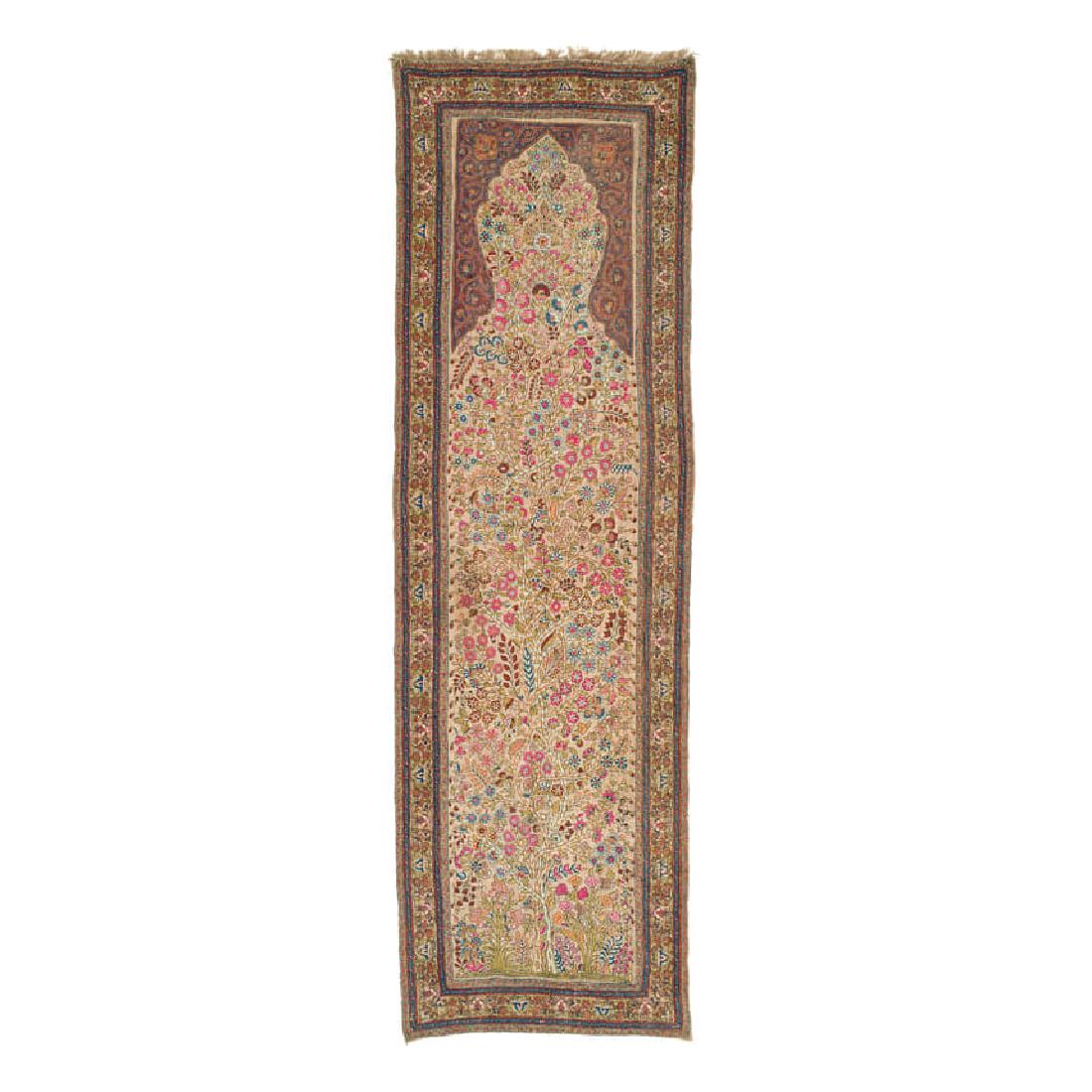Kerman Embroidery: Late 19th century, 260 x 76 cm, South Persia A wool yarn embroidery on an ivory wool foundation. This elegant and meticulously executed work in pastel shades either served as a wall hanging or as a cu